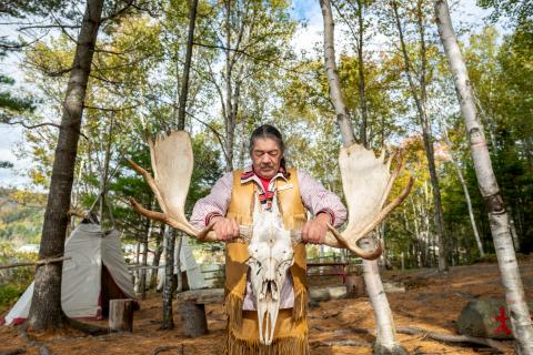 Image of Indigenous man holding moose skull in Eskasoni