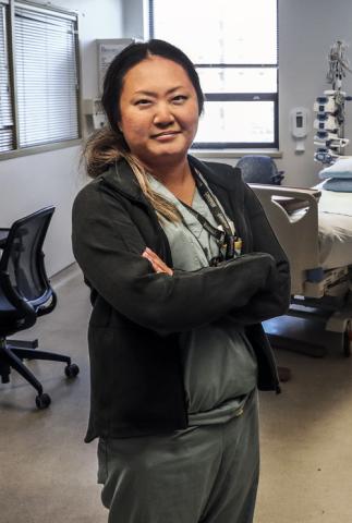 Famele ICU Nurse Standing with folded arms