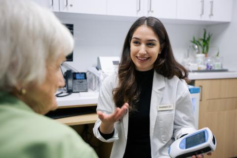 Pharmacist speaking with a patient  