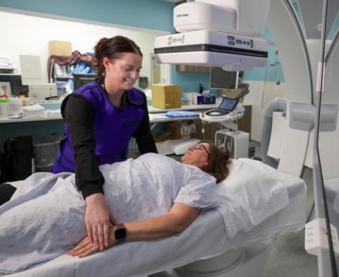 Lady under an x-ray machine