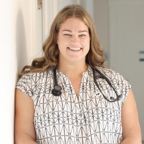 Nurse with stethoscope in clinical setting